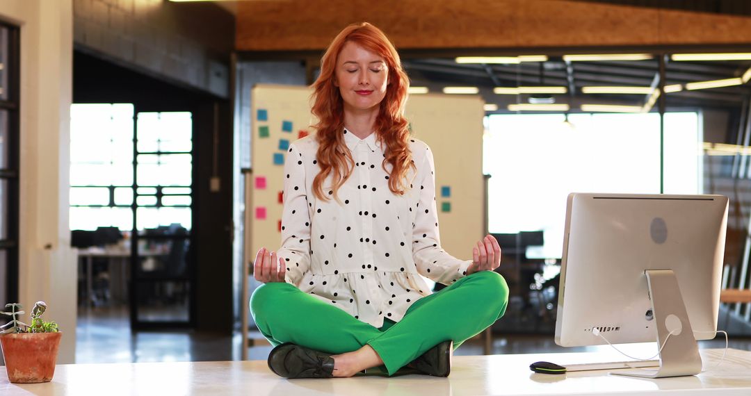 Woman Meditating on Desk in Modern Office - Free Images, Stock Photos and Pictures on Pikwizard.com