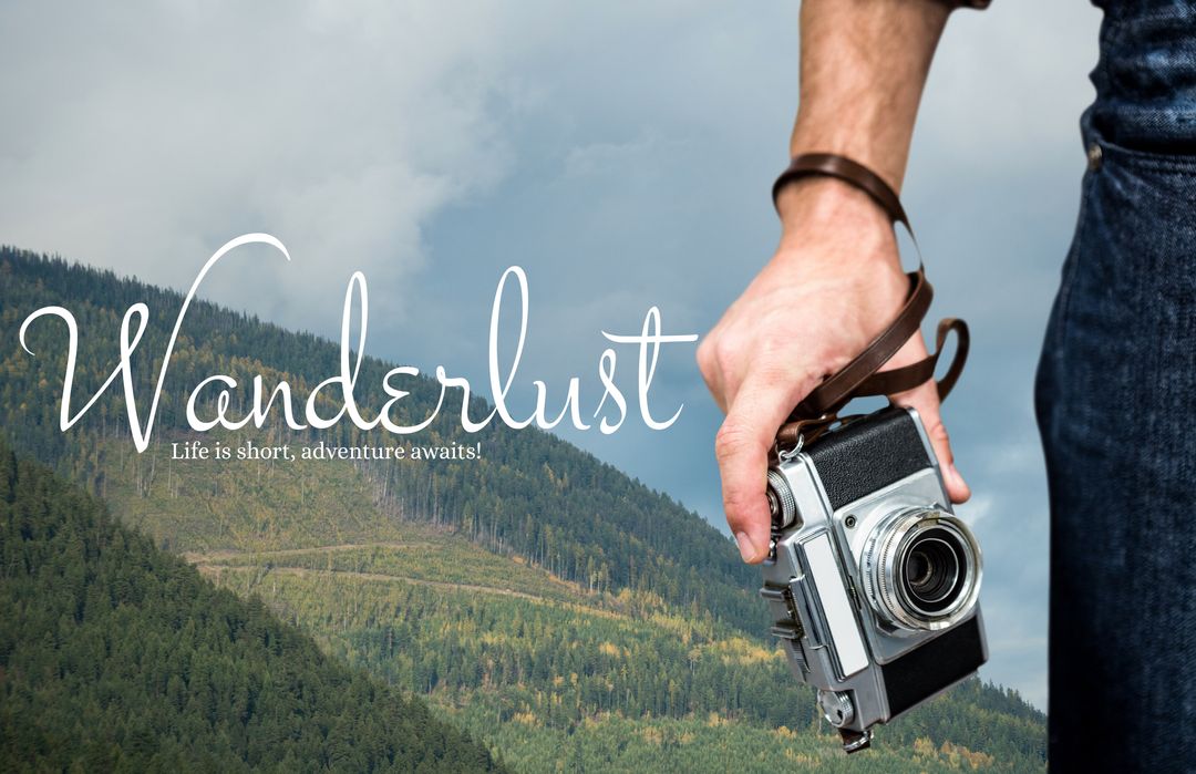 Man Holding Camera with Wanderlust Text Over Lush Hillside - Download Free Stock Templates Pikwizard.com