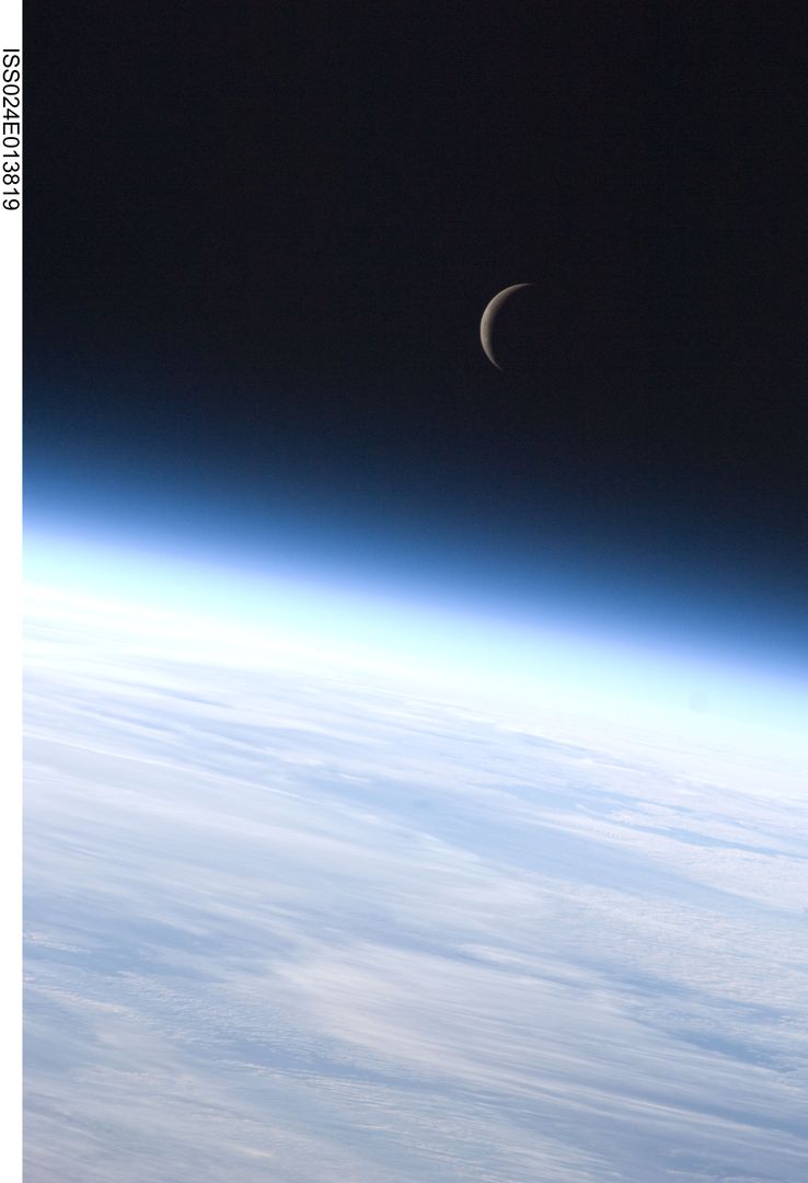 Crescent Moon Above Earth's Horizon Seen from ISS - Free Images, Stock Photos and Pictures on Pikwizard.com