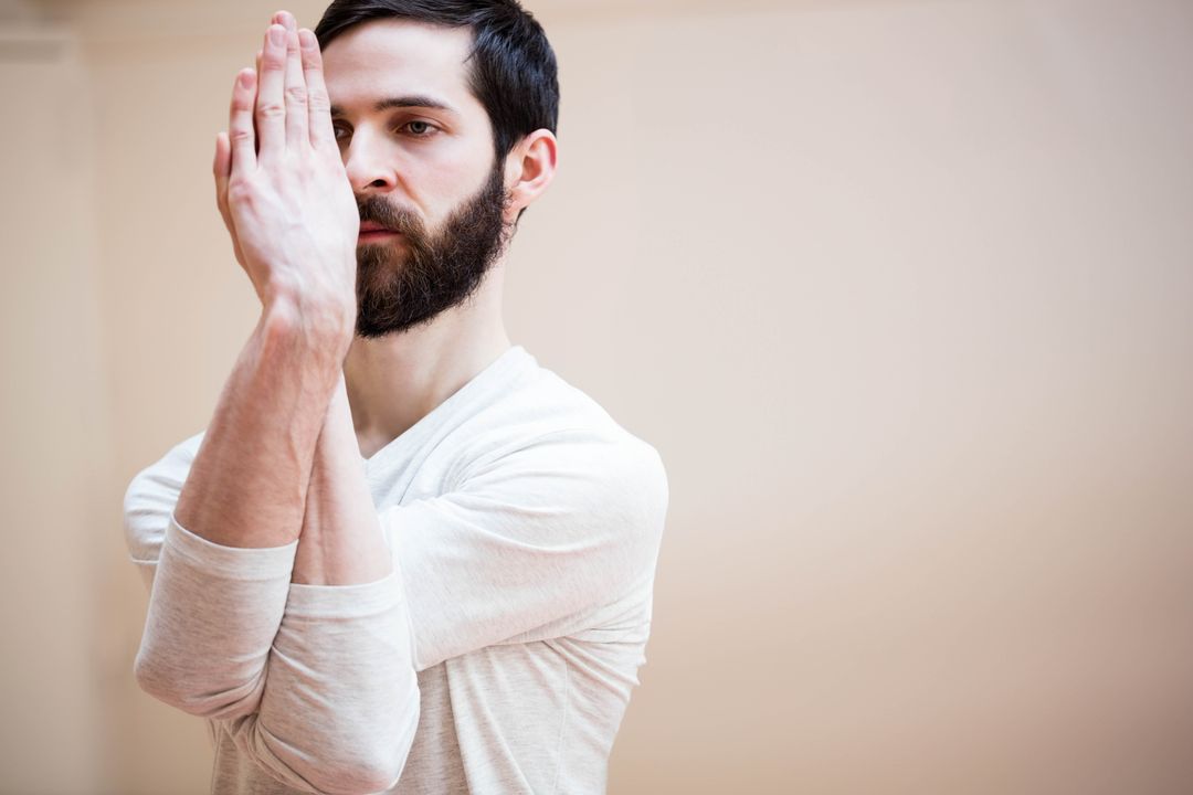 Man Practicing Yoga Pose Indoors Focused on Tranquility