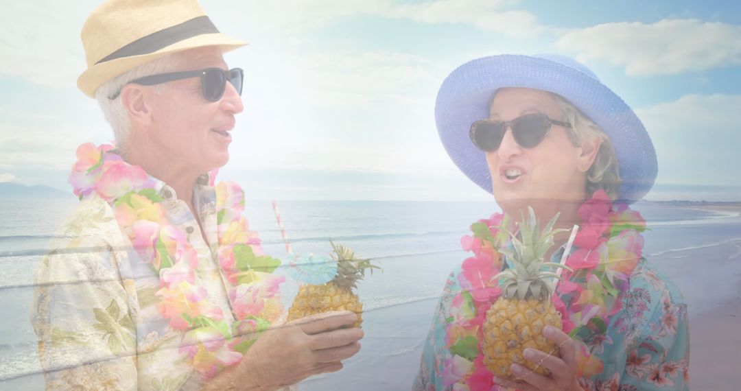 Senior Couple Enjoying Tropical Drinks on Beach