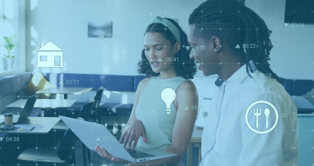 Business Colleagues Analyzing Reports on Laptop with Digital Overlay