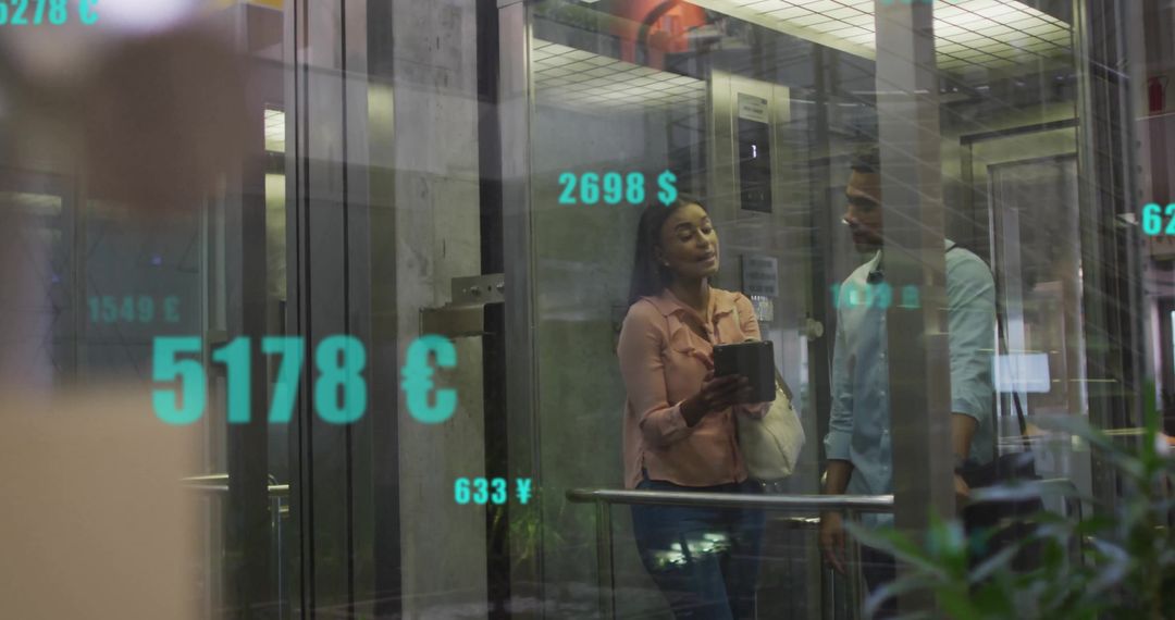 Colleagues in Modern Office Discussing with Digital Financial Data Overlay