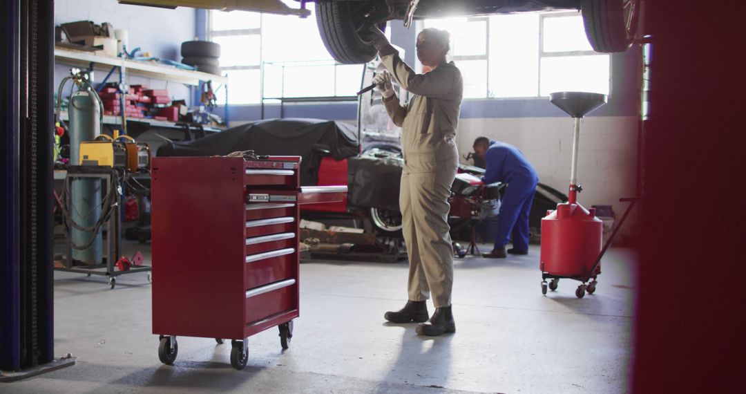 Professional Mechanics Repairing Car in Auto Workshop - Free Images, Stock Photos and Pictures on Pikwizard.com