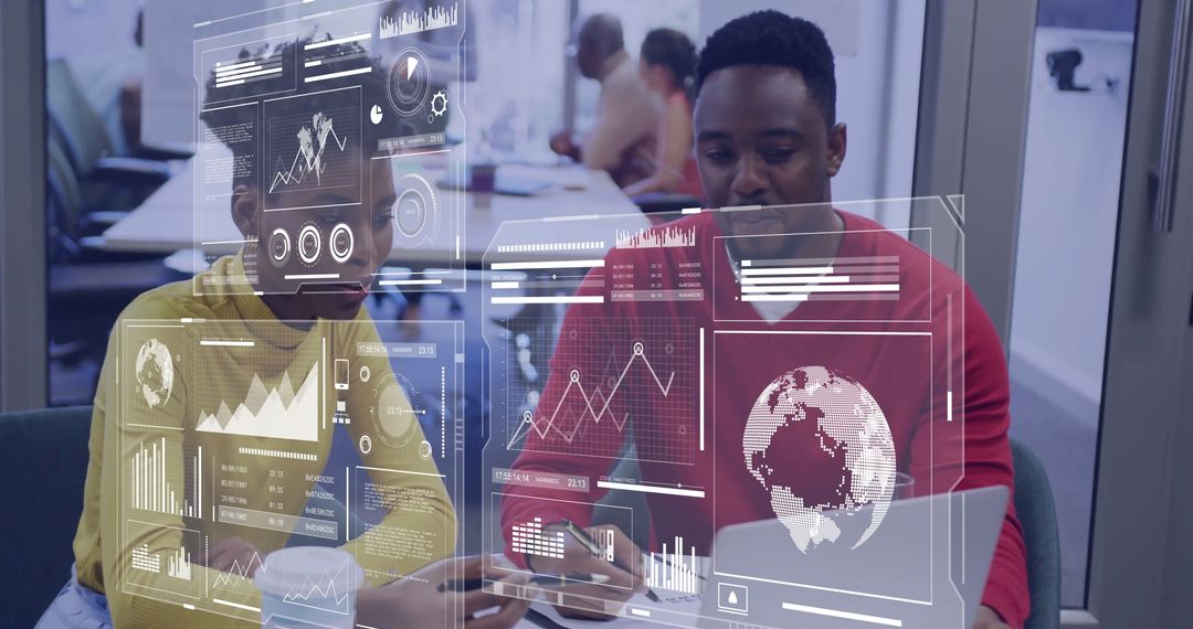 Business Colleagues Analyzing Holographic Data at Workspace