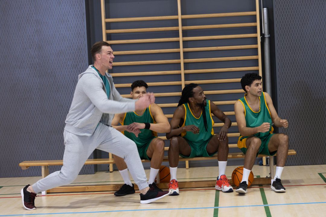 Excited Basketball Coach Shouting Instructions to Focused Team