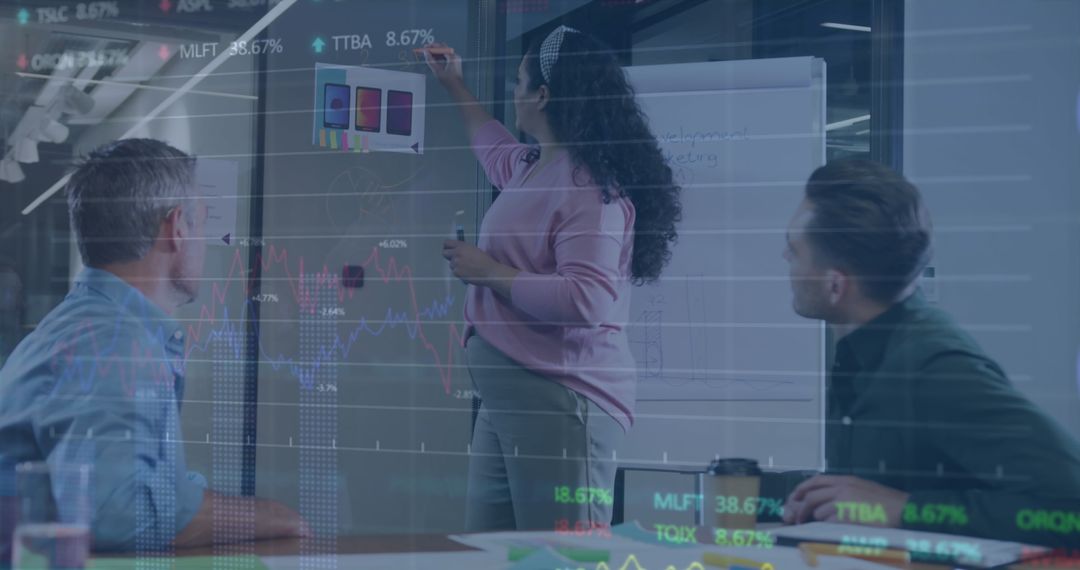 Coworkers Analyzing Financial Data Collaborate in Modern Office