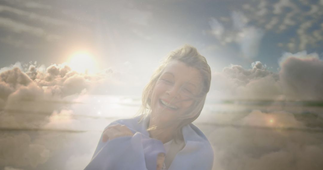 Young Woman Smiling Amidst Dreamy Clouds at Sunrise - Free Images, Stock Photos and Pictures on Pikwizard.com