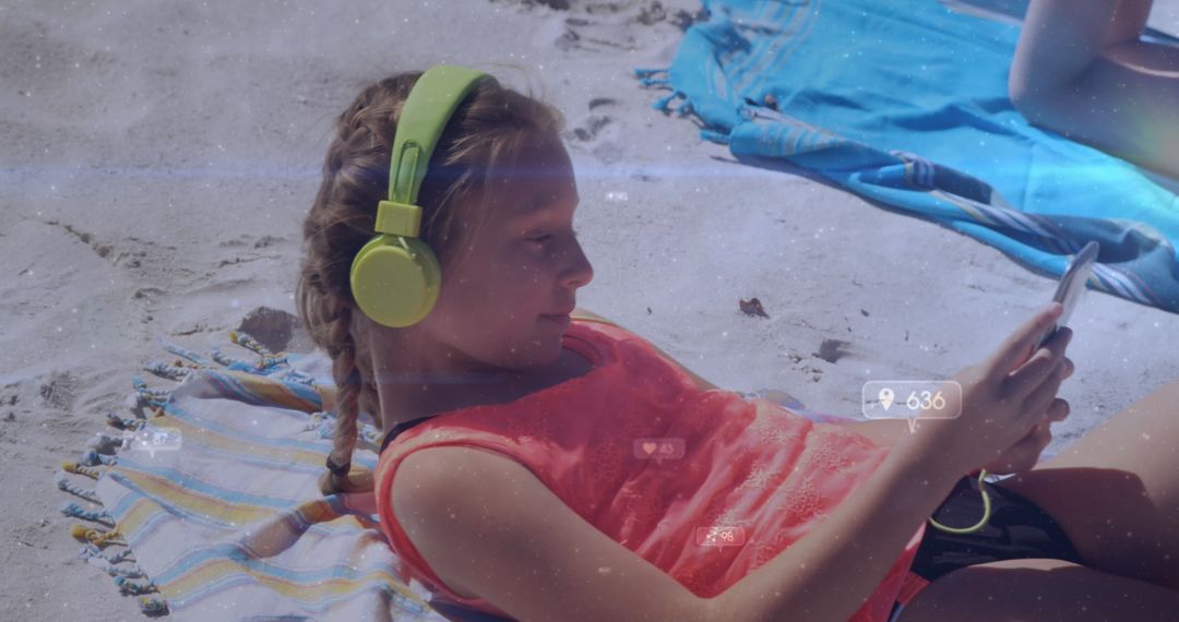 Girl Relaxing on Beach Listening to Music on Smartphone