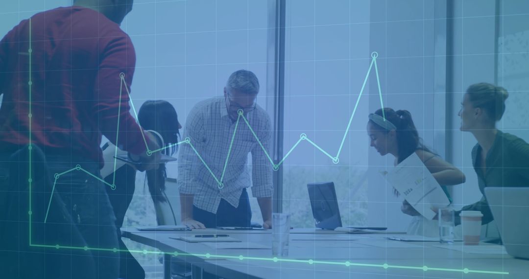 Diverse Team Analyzing Financial Growth in Modern Office