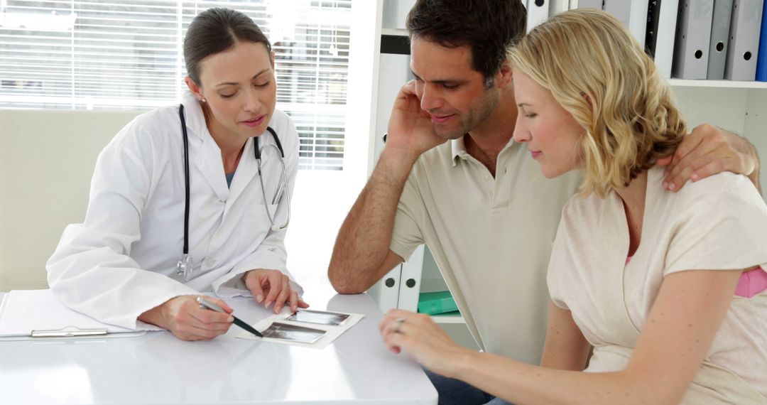 Obstetrician Discussing Ultrasound with Expectant Parents