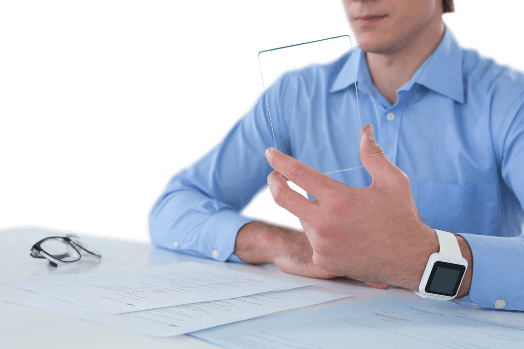 Businessman with Transparent Digital Interface Tablet and Paperwork
