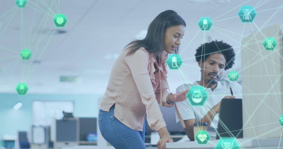 Diverse Colleagues Analyzing Digital Interface in Modern Office