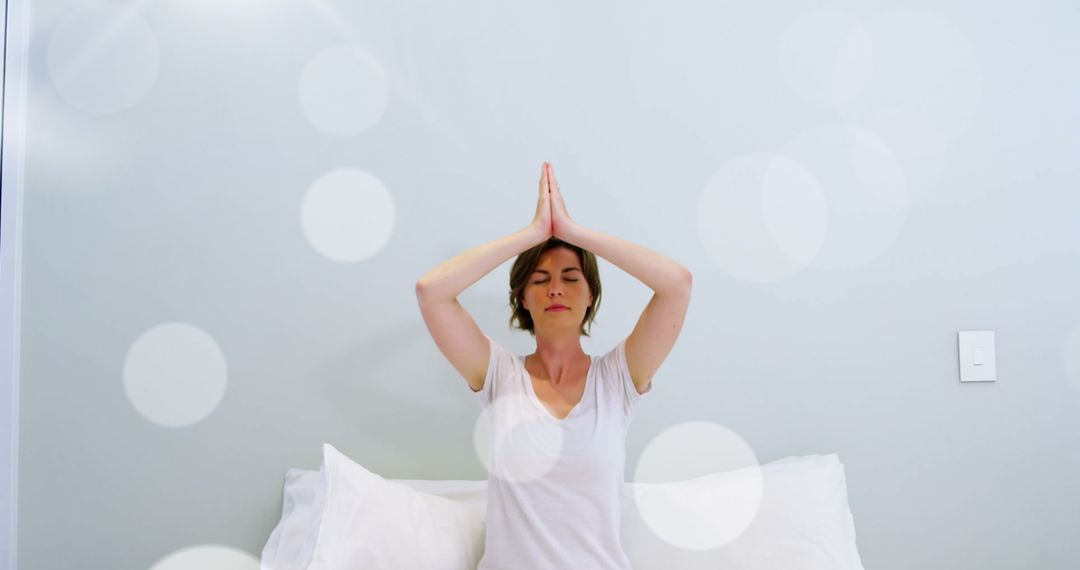 Caucasian Woman Meditating in Calming Environment with Bokeh Effect