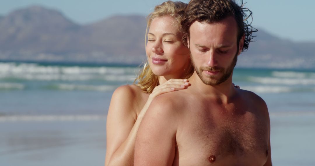 Romantic Couple Relaxing on Beach at Sunset - Free Images, Stock Photos and Pictures on Pikwizard.com