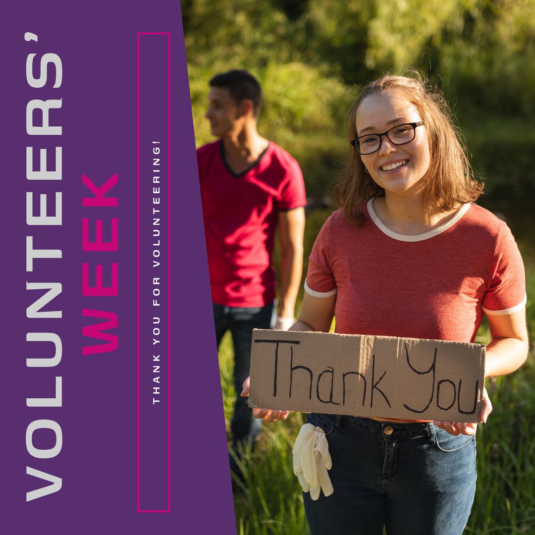 Smiling Volunteer with Thank You Sign Celebrating Volunteers' Week