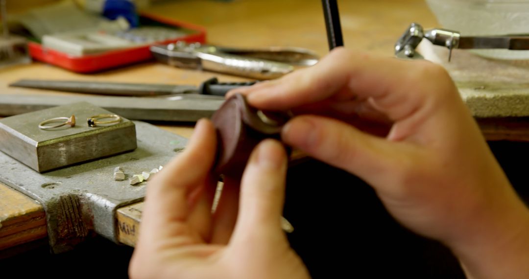 Close-Up of Jewelry Maker Handling A Ring in Workshop - Free Images, Stock Photos and Pictures on Pikwizard.com