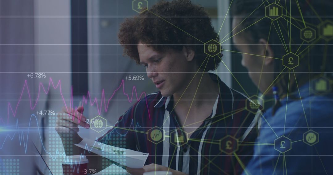 Diverse Professionals Analyzing Data with Digital Graphics Overlays