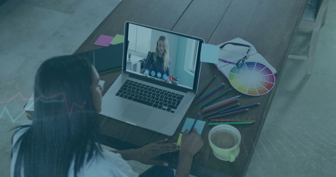 Graphic Designer Attending Online Meeting From Home Workspace