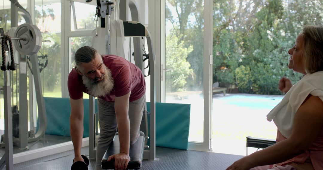 Senior Couple Engaging in Exercise Routine at Home Gym