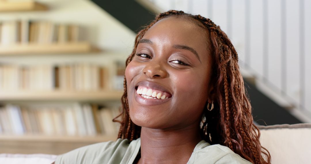 Smiling Woman Relaxing on Comfortable Sofa at Home