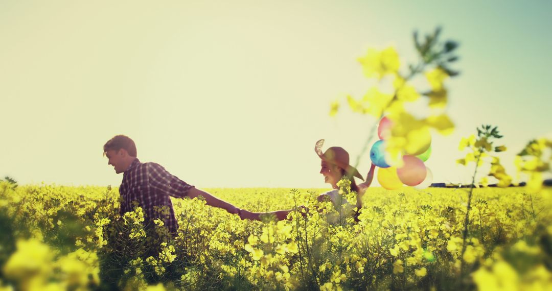 Happy Couple Enjoying Field of Yellow Flowers - Free Images, Stock Photos and Pictures on Pikwizard.com