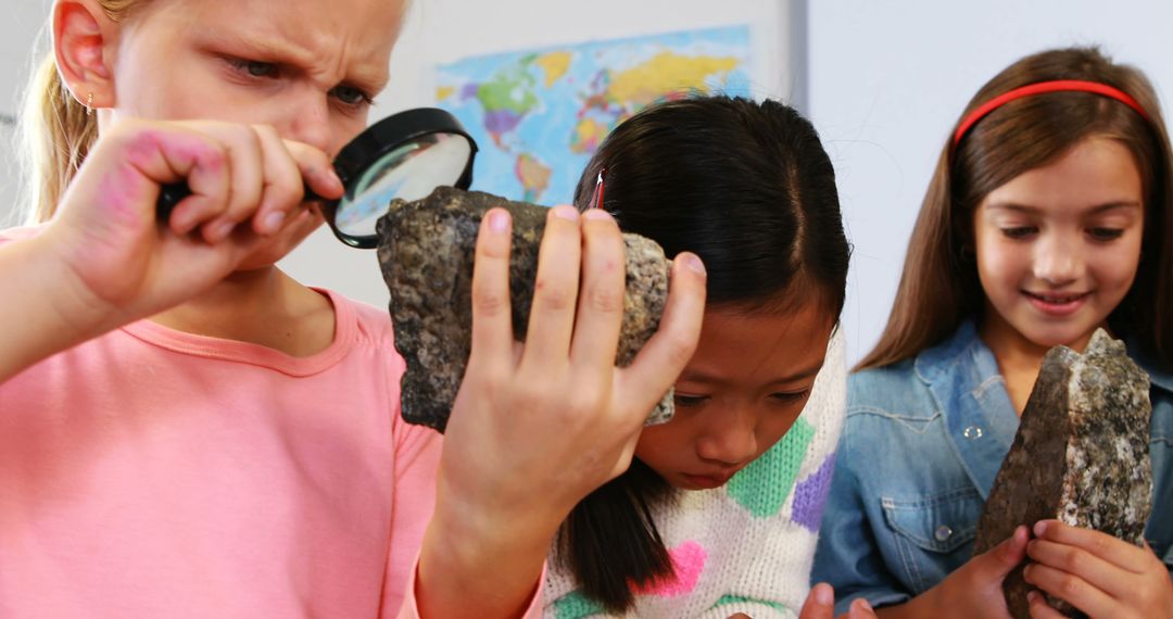 Curious Students Examining Rocks with Magnifying Glass - Free Images, Stock Photos and Pictures on Pikwizard.com