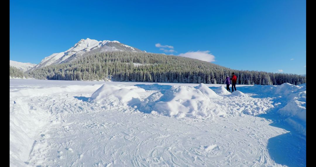 Couple Enjoying Winter Day in Scenic Mountain Landscape - Free Images, Stock Photos and Pictures on Pikwizard.com