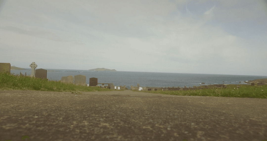 Transparent View of Seaside Cemetery and Tranquil Ocean
