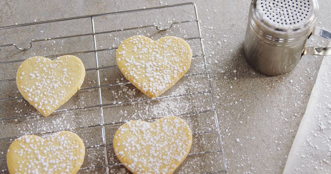 Heart-Shaped Sugar Cookies on Cooling Rack with Powdered Sugar Sifter - Free Images, Stock Photos and Pictures on Pikwizard.com