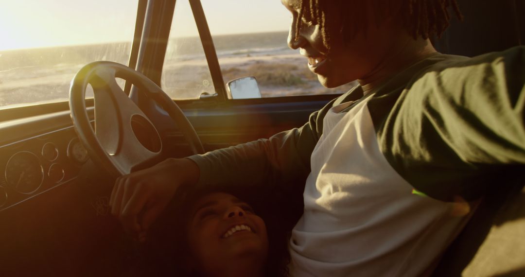 Couple Relaxing in Car during Sunset by Beach