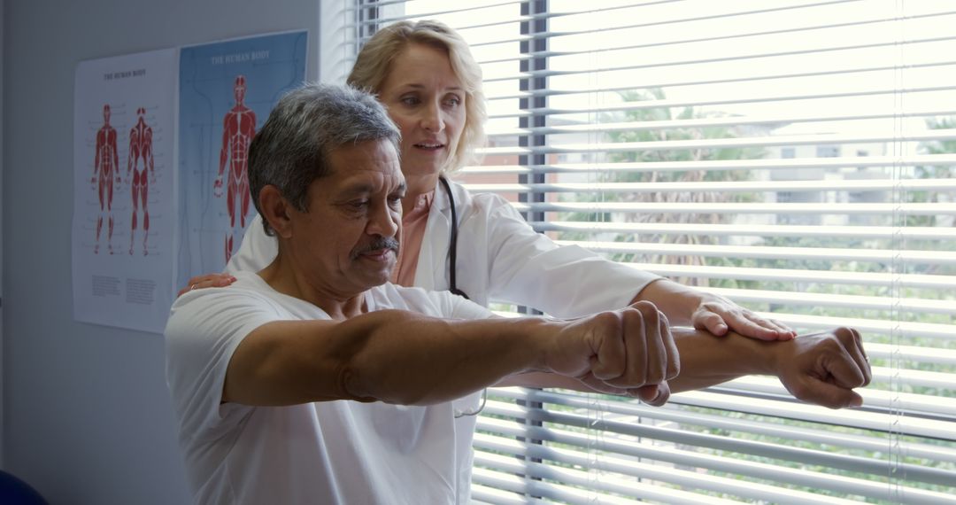 Senior Man Undergoing Physical Therapy Guided by Professional Therapist - Free Images, Stock Photos and Pictures on Pikwizard.com