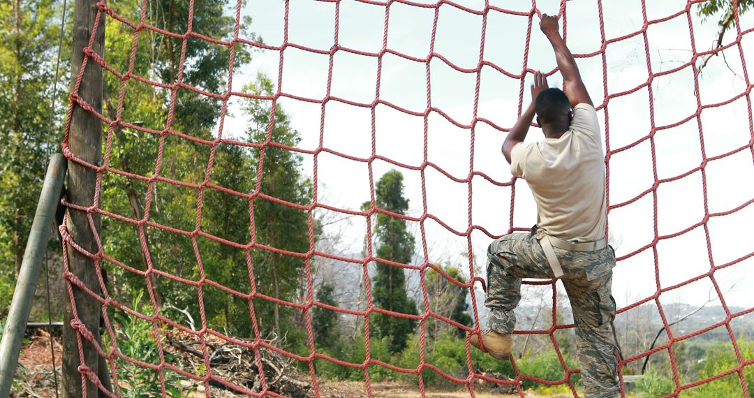 Military Personnel Navigating Obstacle Course During Training