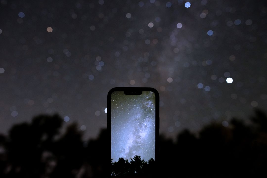 Technology smartphone displays starscape with night sky backdrop