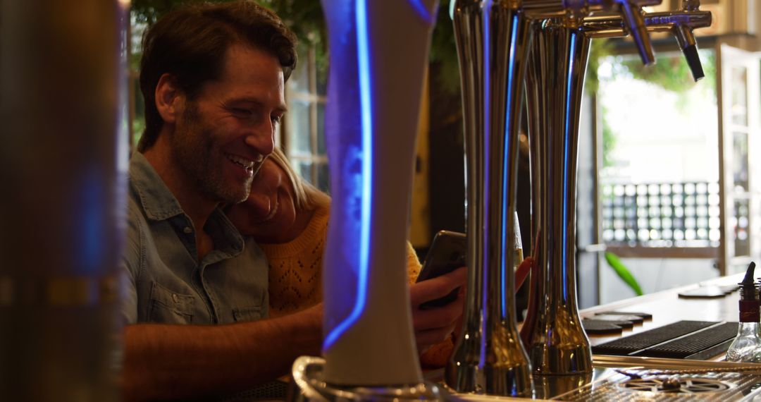 Couple Enjoying Time at Bar With Modern Beer Taps - Free Images, Stock Photos and Pictures on Pikwizard.com