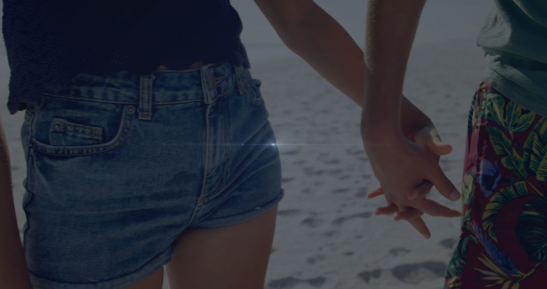 Couple Holding Hands on a Sunny Beach Daytime Scene