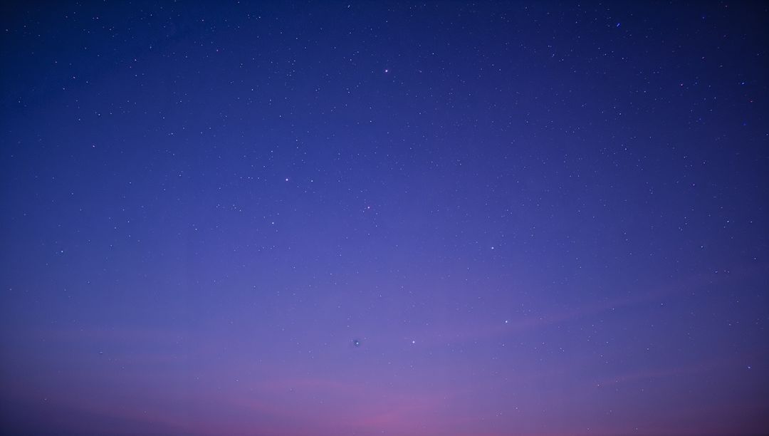 Starry Twilight Sky with Gradient from Blue to Pink