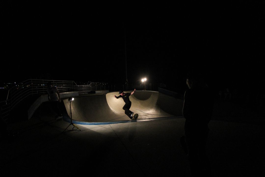 Skateboarder Grinding Mid-Air Trick at Night in Skate Park - Free Images, Stock Photos and Pictures on Pikwizard.com