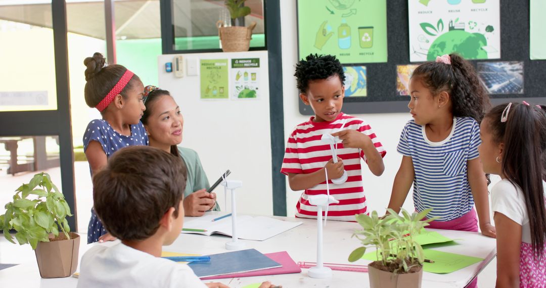 Teacher Guiding Students in Renewable Energy Project Discussion