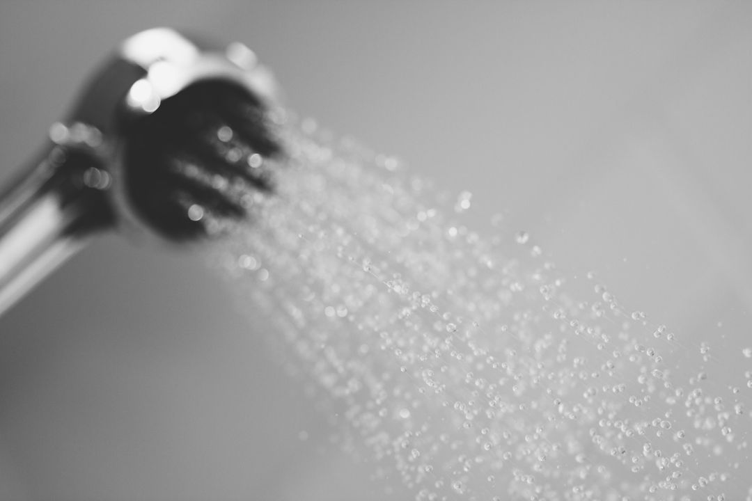 Close-Up of Shower Head with Flowing Water in Monochrome - Free Images, Stock Photos and Pictures on Pikwizard.com