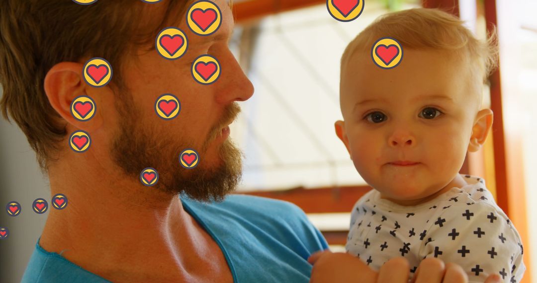 Father Holding Baby with Digital Heart Icons for Parenthood Theme