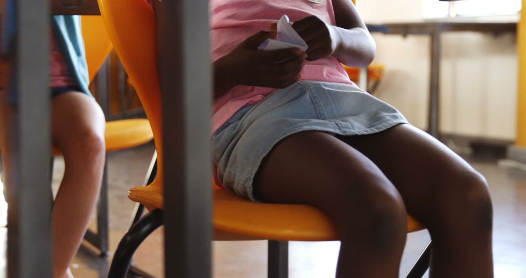 Children Wearing Casual Clothes Sitting in Classroom - Free Images, Stock Photos and Pictures on Pikwizard.com