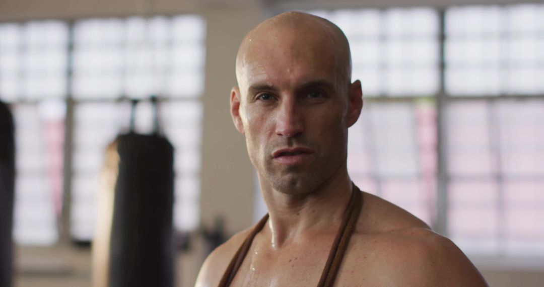 Determined Athlete With Jump Rope in Boxing Gym
