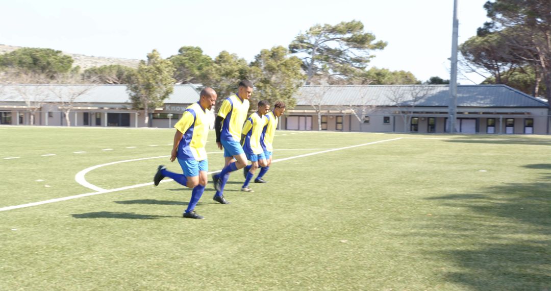 Soccer Team Running Drills During Training Session on Field