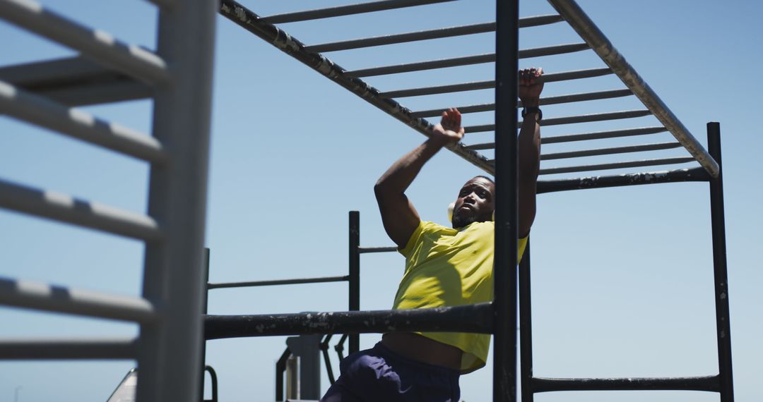 Athletic Man Exercising on Outdoor Monkey Bars - Free Images, Stock Photos and Pictures on Pikwizard.com