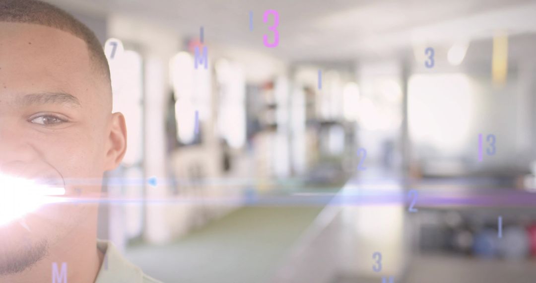 Smiling Young Man Posing in Bright Coworking Space with Futuristic Numeric Overlay