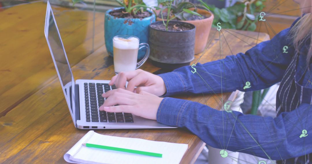 Woman in Denim Using Laptop at Rustic Cafe Workspace