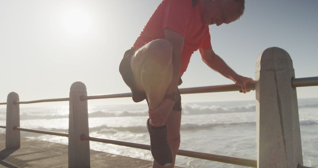 Senior Man Stretching Leg during Sunrise Running Workout - Free Images, Stock Photos and Pictures on Pikwizard.com