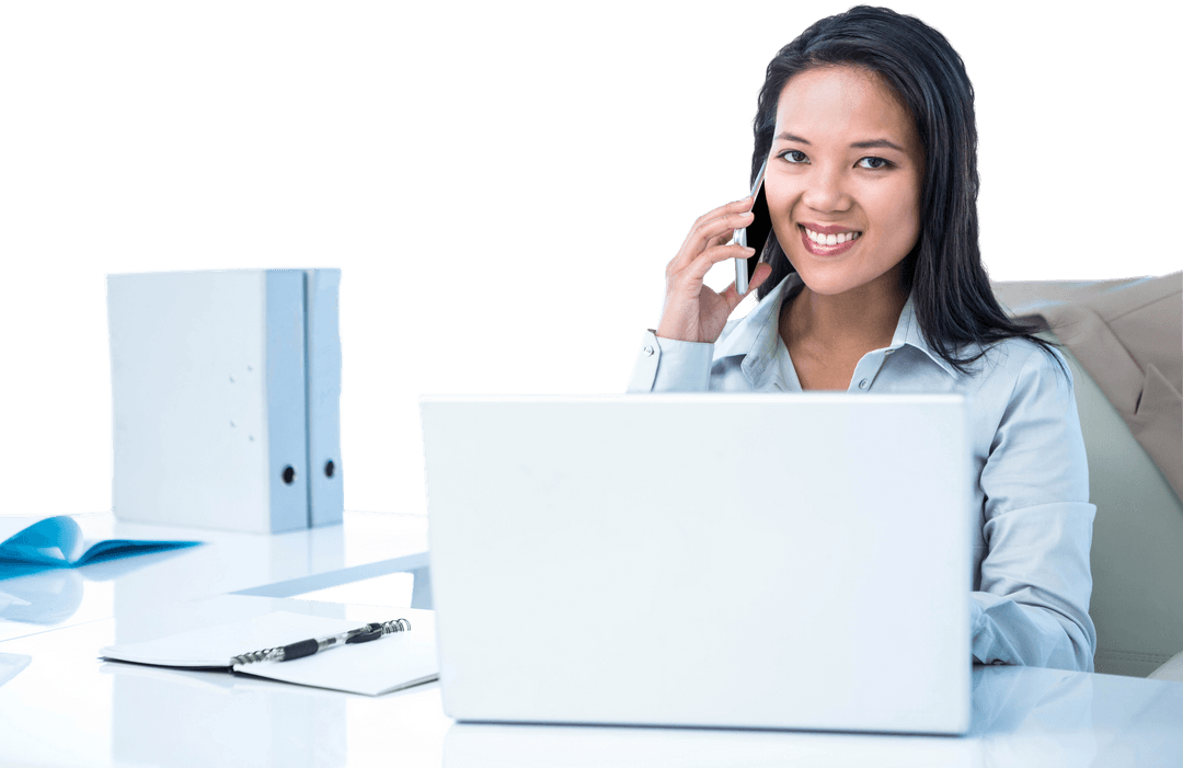 Smiling Businesswoman Phoning at Desk Using Transparent Laptop