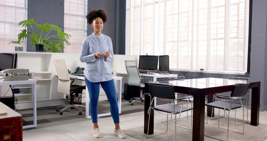Confident Woman Presenting in Bright Modern Office Space
